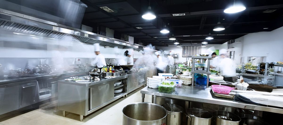 modern kitchen and busy chefs, used restaurant equipment, sustainability, used business equipment