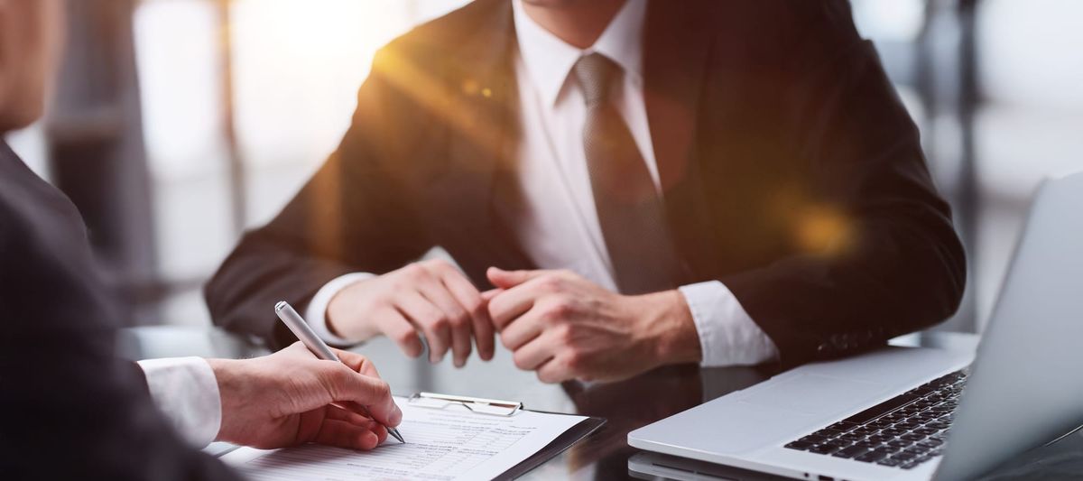 Lender reviewing paperwork with client