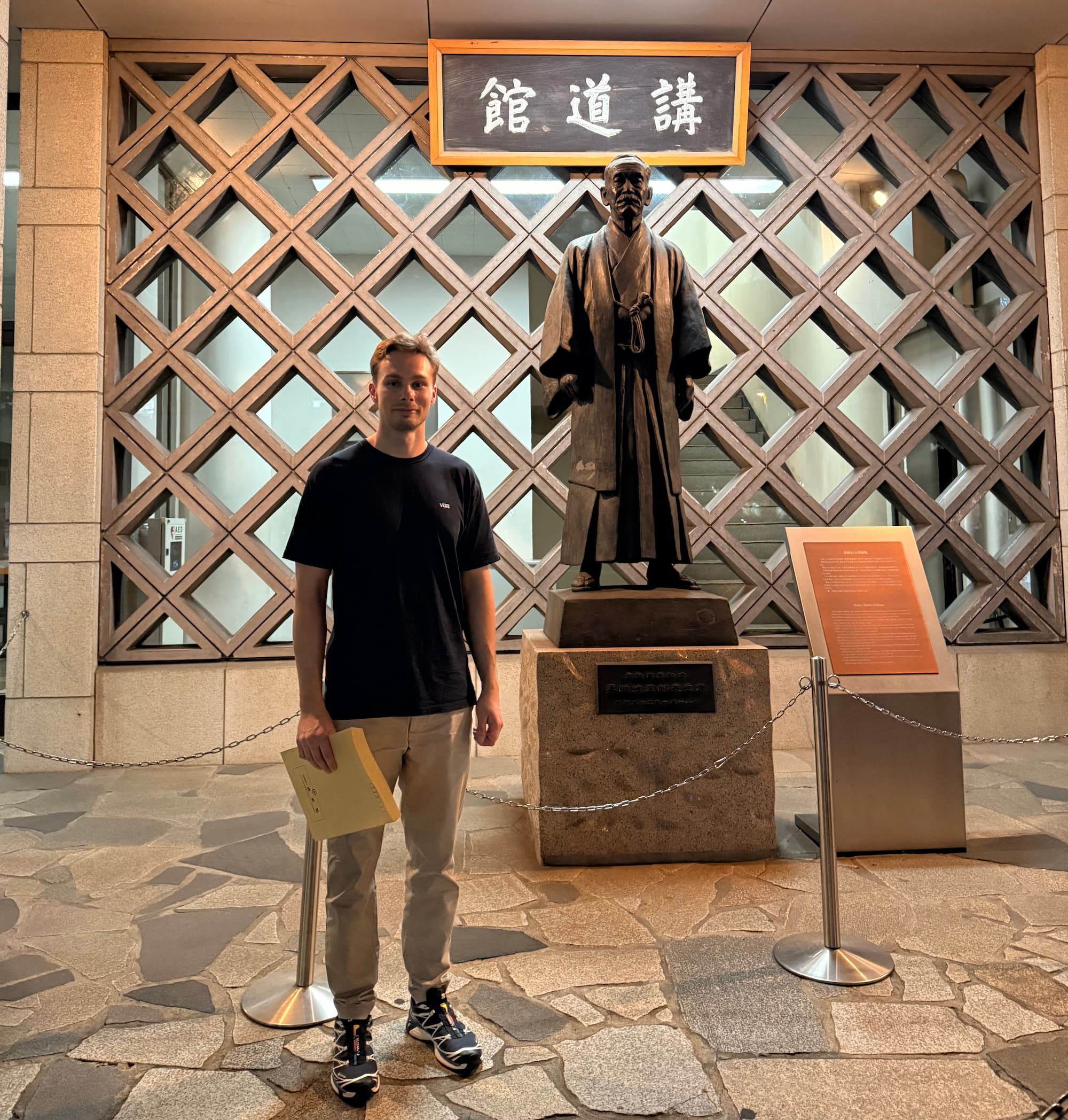 A statue of Jigoro Kano - founder of Judo, and me with my application forms.