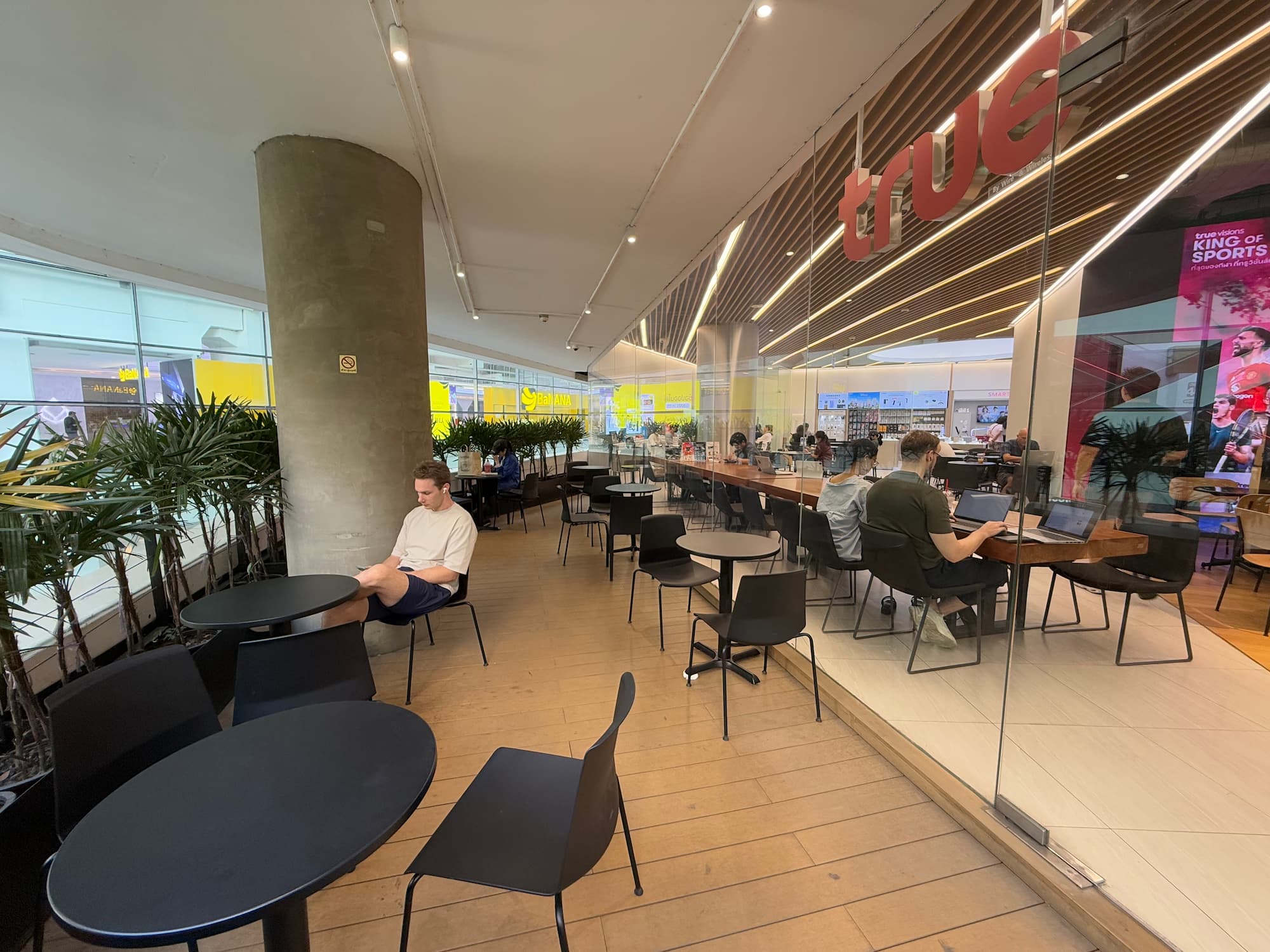 Digital nomads working at True Coffee Emquartier Bangkok