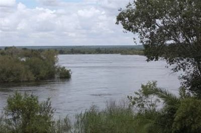 Photo of a stretch of the Zambezi River in 2010 rising out of its banks.