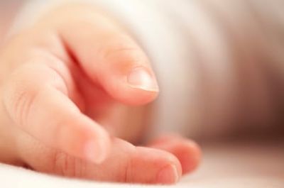  Close-up photo of baby's hand.