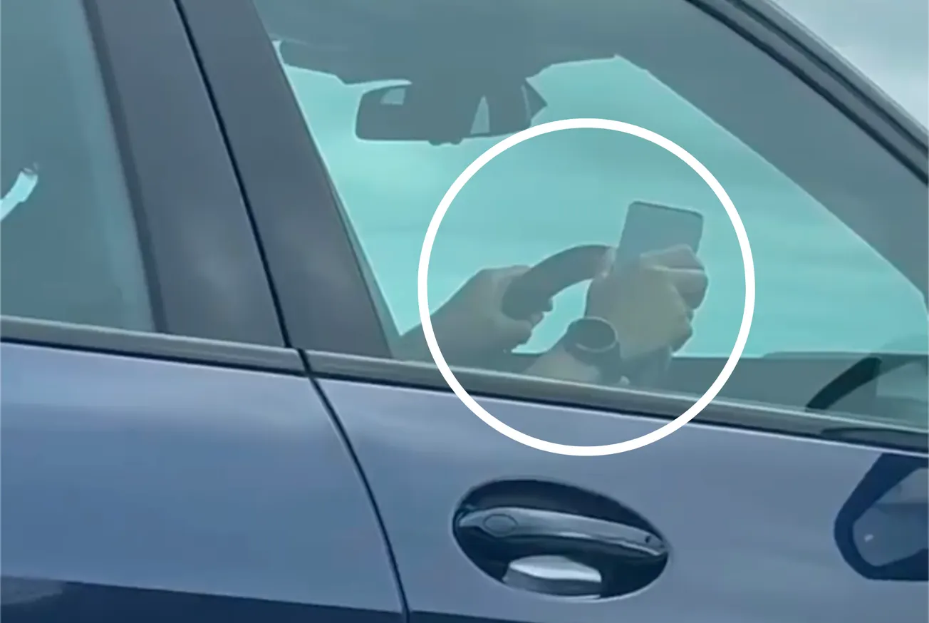 Blue light vehicle driver reported to the police after caught holding mobile phone while at the wheel