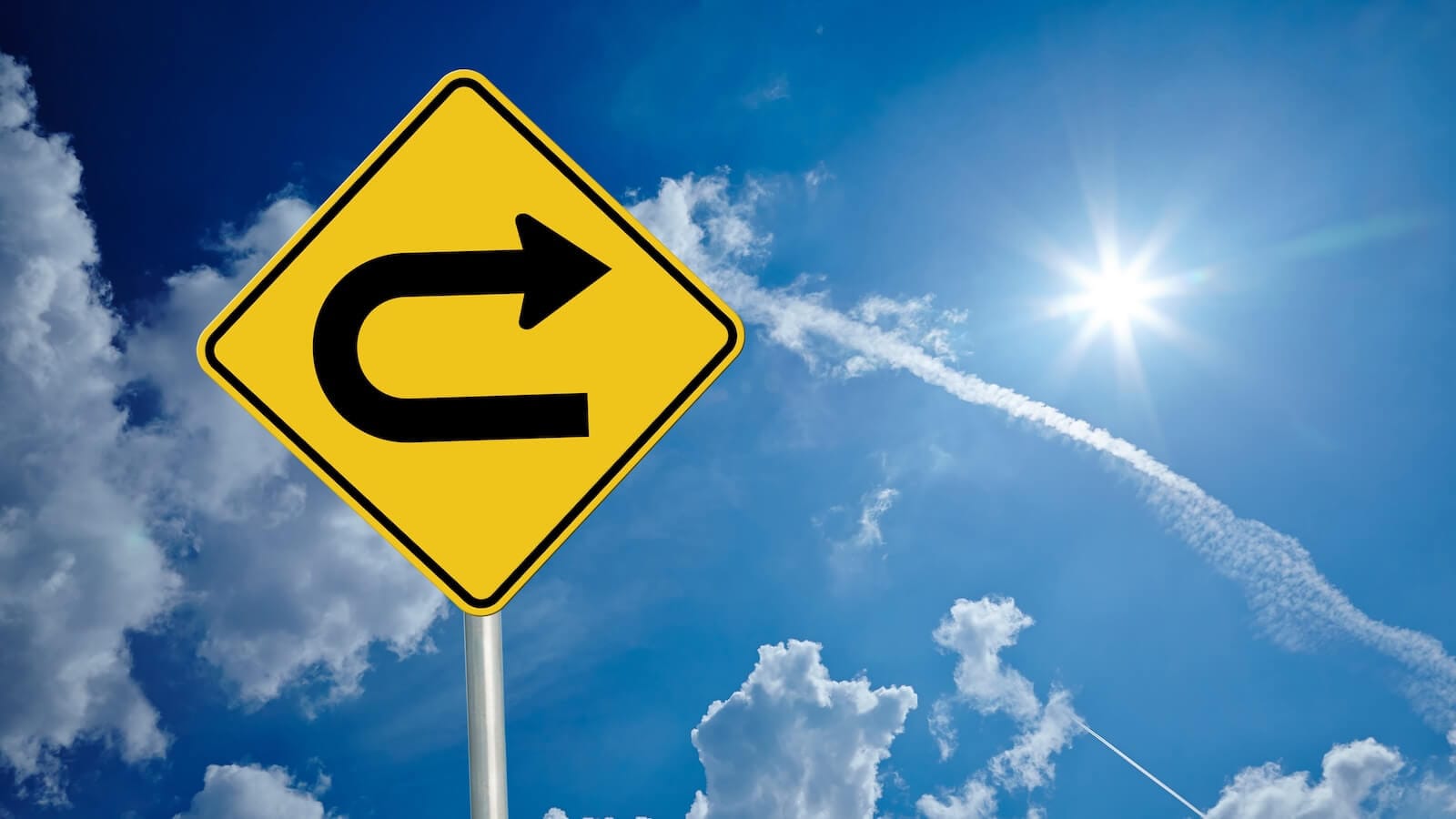 Image of a U-turn sign reflecting turaround day in the stock market