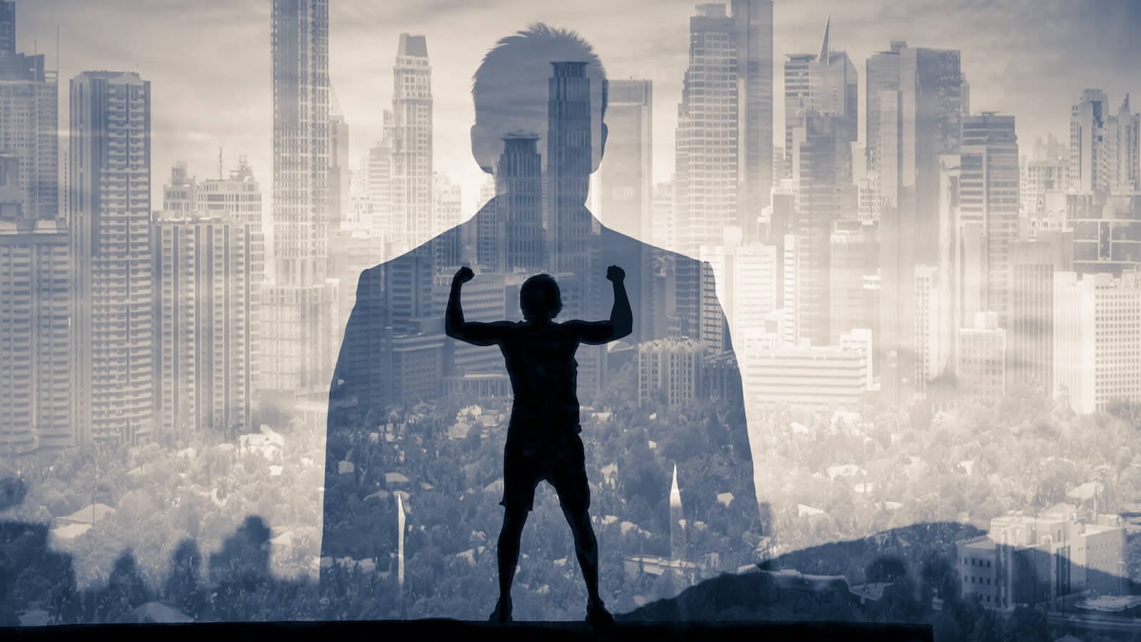 Image of person showing muscles in the shadow of a larger man