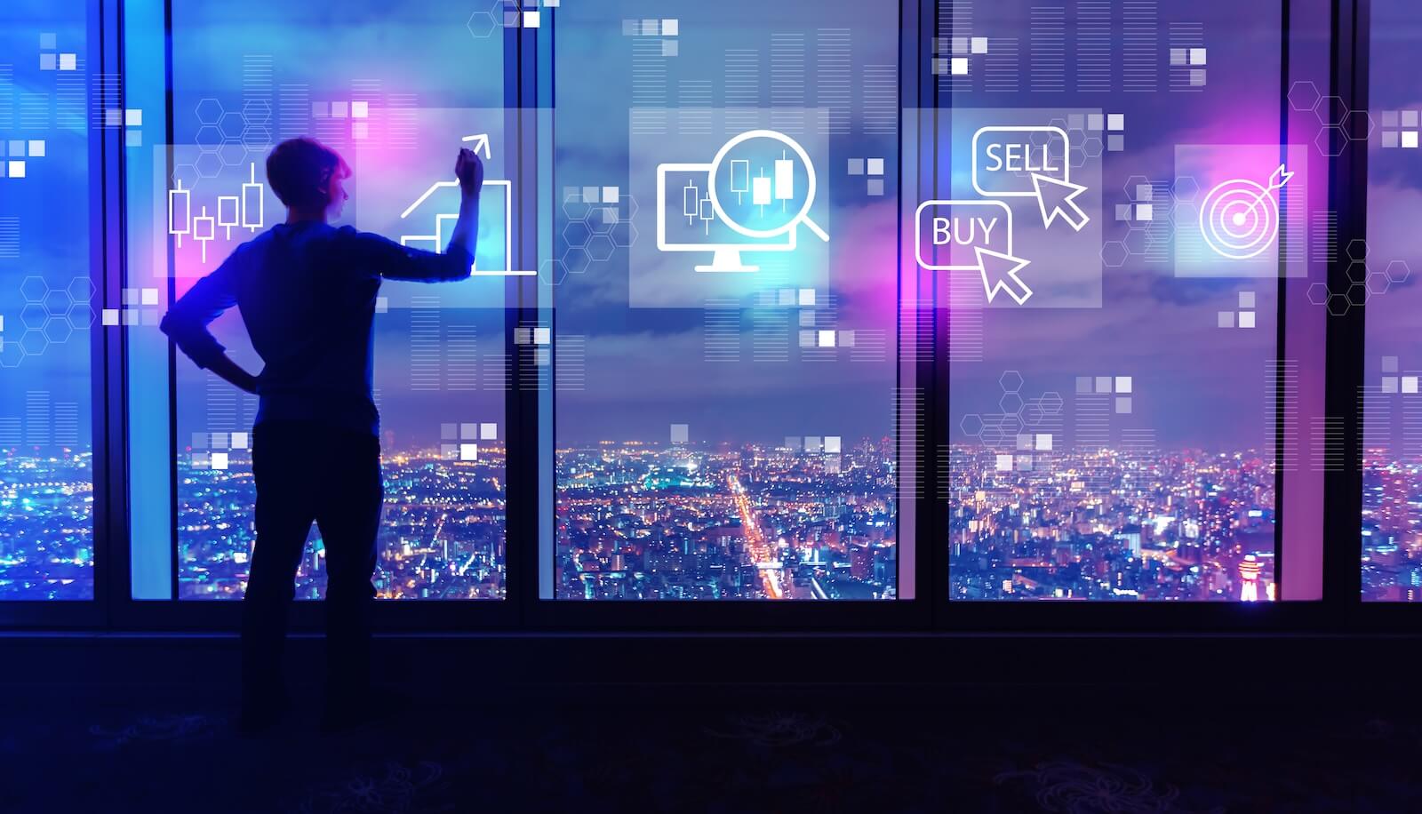 Man drawing charts on windows to prepare