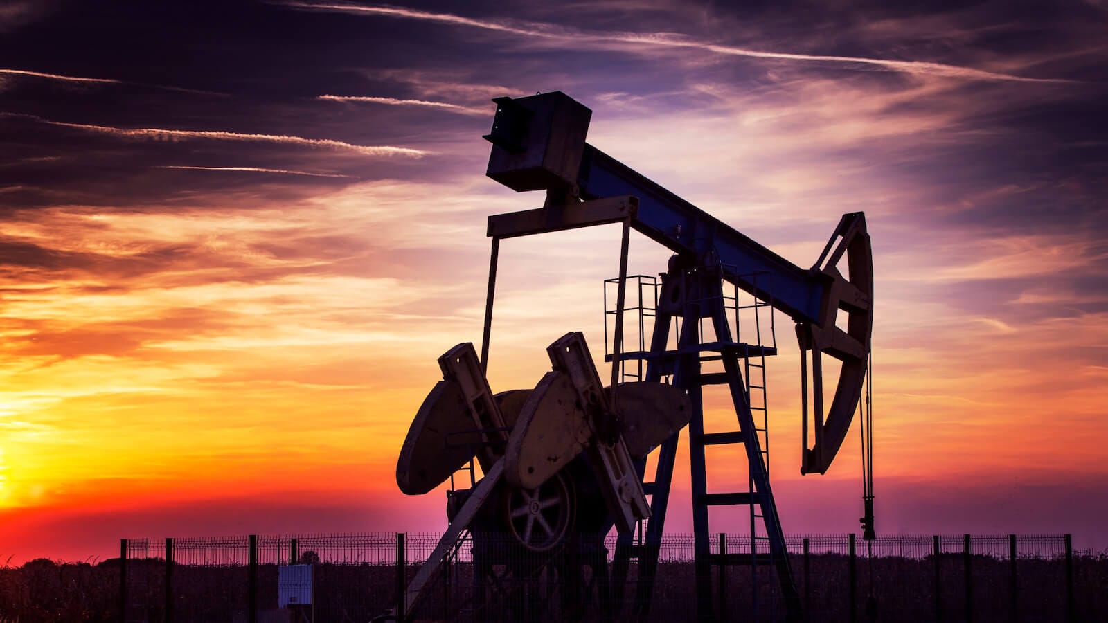 Oil rig with sunset in background
