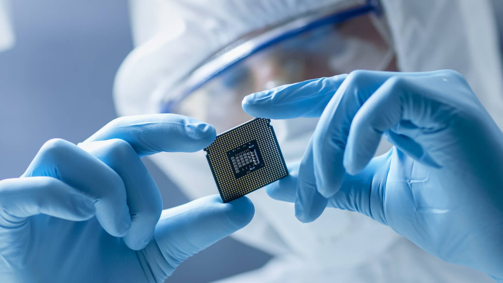 Lab worker looking at a chip