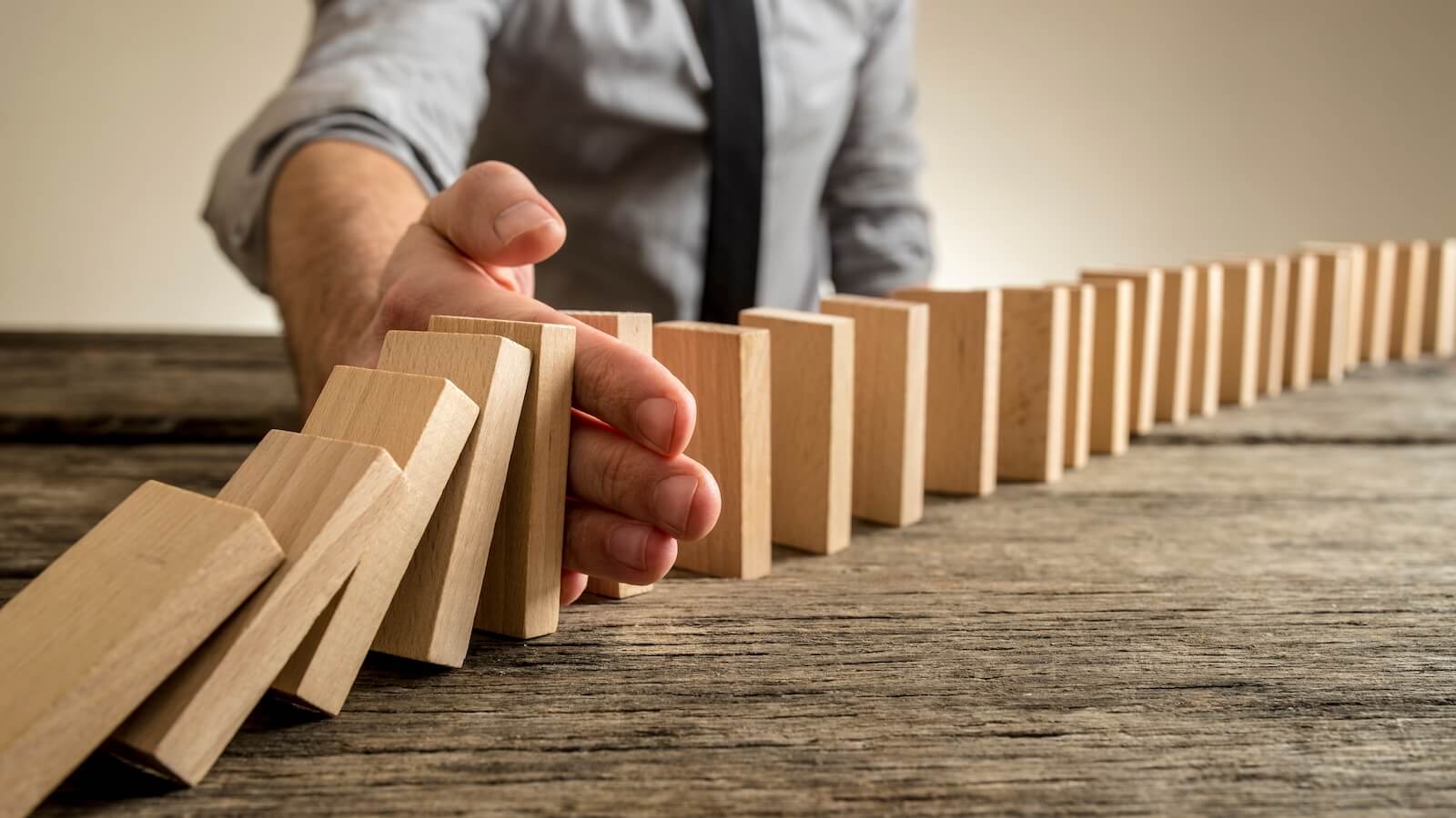 Man stopping domino effect: Did stock market first domino fall 