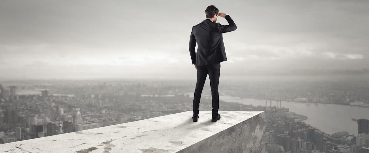 Business man looking over edge: week ahead for the Nifty