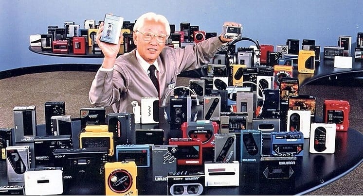 Morita surrounded by dozens of colorful Walkmans