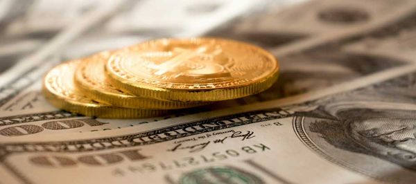 Gold coins and one-hundred dollar bills - Mathieu Stern - Unsplash