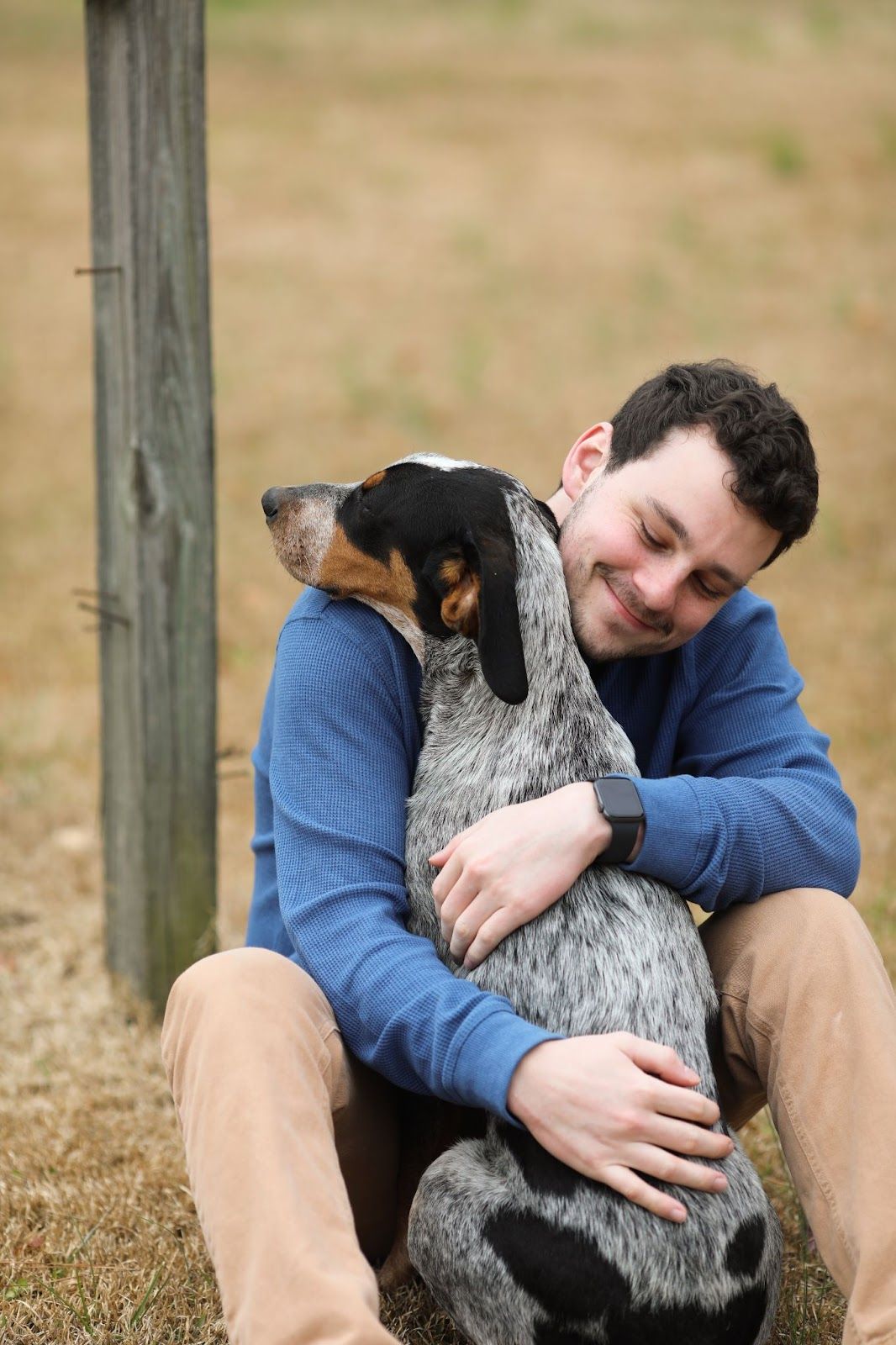 owner hugging dog