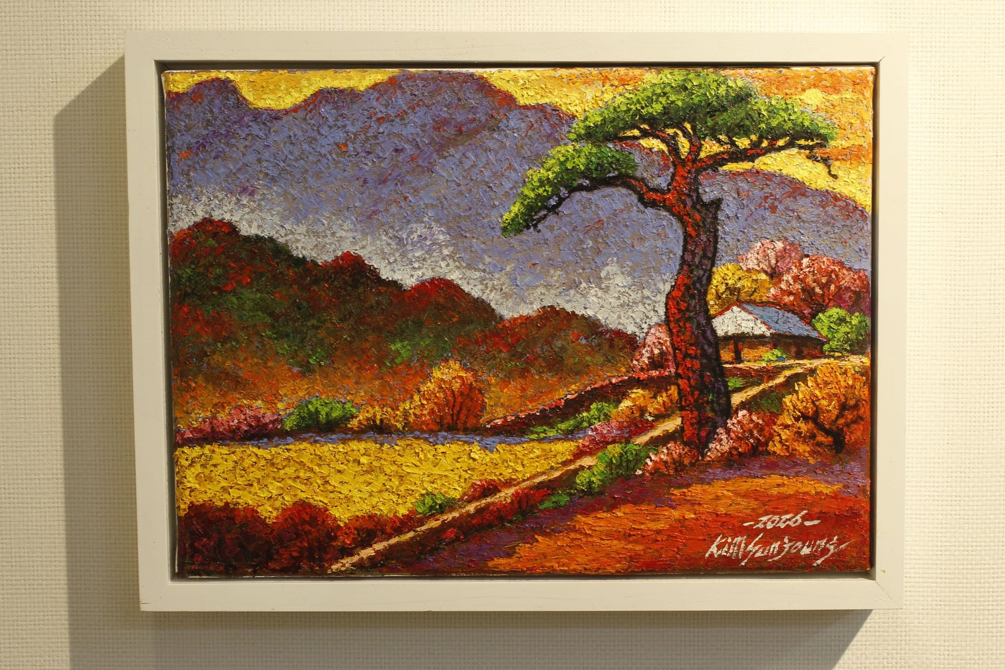 An impressionist or post-impressionist style painting with of a mountainside, field, and a gnarled Korean pine tree with green pine leaves only at the top.