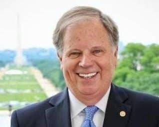 “Do-Nothing Doug” Lectures Alabama While President Trump Leads