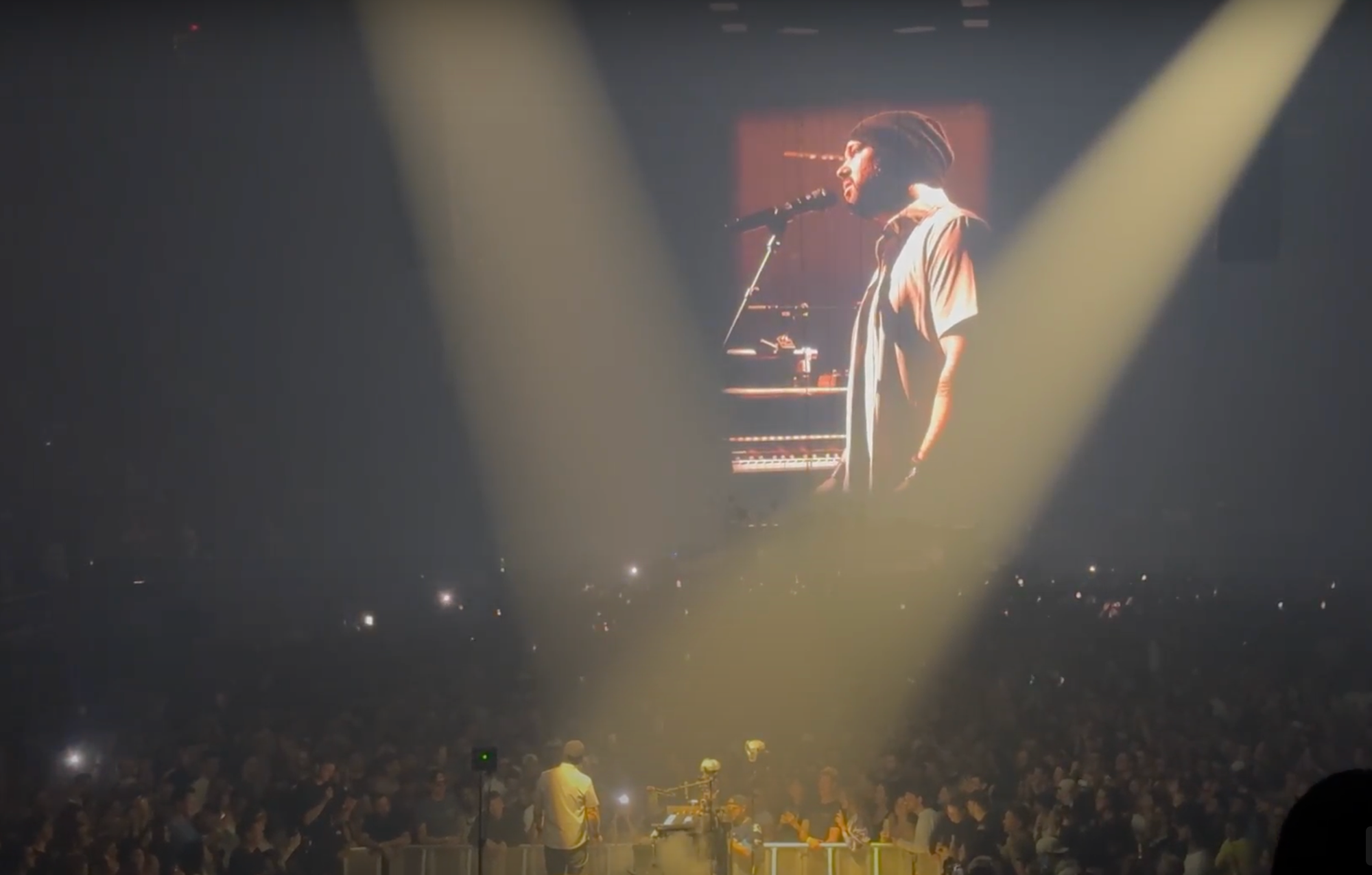 photo of KTM surrounded by a sea of people, projected onto a big screen