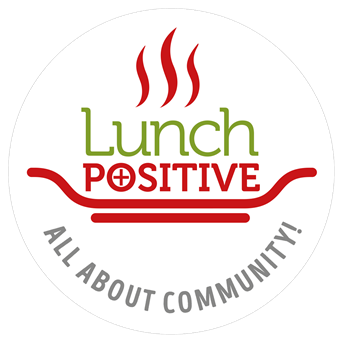 Circular logo with red steam lines above "Lunch POSITIVE" text in green and red, featuring a red bowl illustration and "ALL ABOUT COMMUNITY!" tagline below on white background.