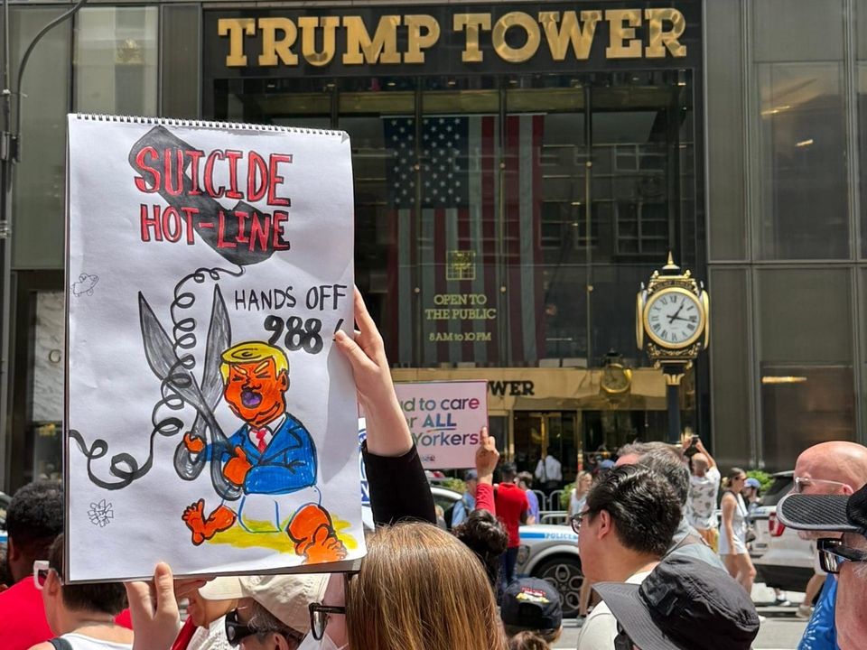 “Hands off 988!”: Protesters rally outside Trump Tower to defend LGBTQ+ crisis lifeline