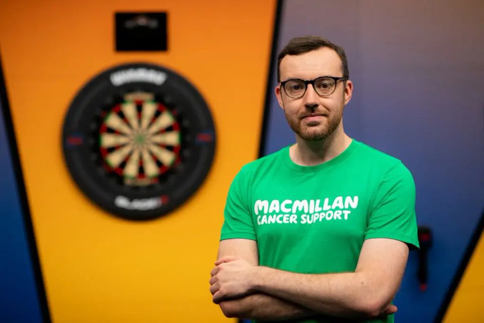 Openly gay darts referee Huw Ware reveals he came close to stepping away from the sport before going on to make history