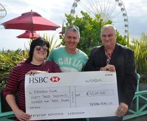 Pride organisers present Rainbow Fund cheque