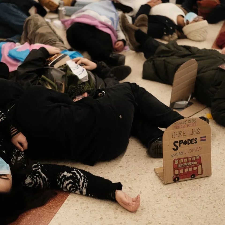Trans activists stage ‘die-in’ at Victoria Station to protest government’s ban on puberty blockers