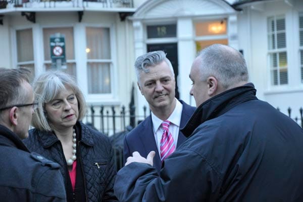 Paul Elgood, chair of the Rainbow Fund explains to the Home Secretary the process for commissioning the Aids Memorial
