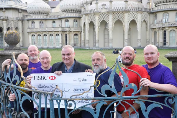 Rainbow Fund Chairman Paul Elgood receives cheque from the Brighton Bear Weekenders