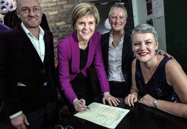First Minister Nicola Sturgeon and Patrick Harvie witness the first same sex marriage just after midnight in Glasgow, on December 31, 2014