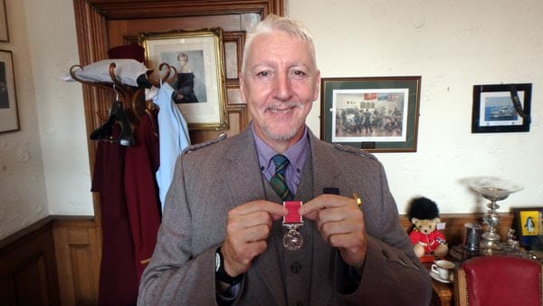 Kinny with his British Empire Medal: Photo by Nic Waller