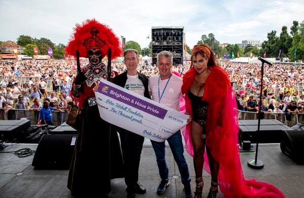 Peter Tatchell receives cheque for £5,000 from Paul Kemp: Photo Chris Jepson