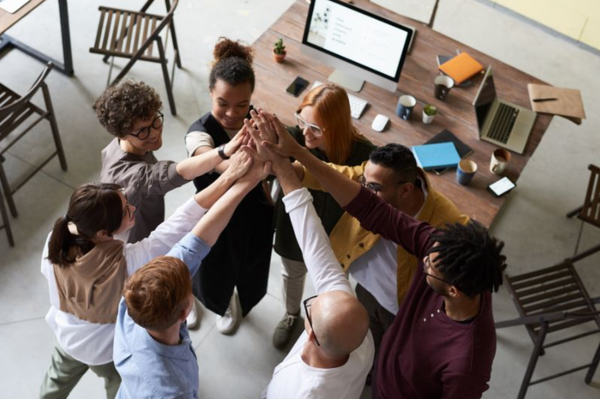 What is the GROW coaching model for better performance?