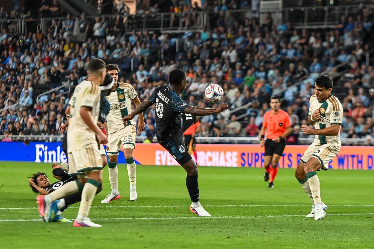 MNUFC striker Mauricio González fires over the net.