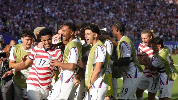 A picture of the USA team celebration after Malik Tillman's goal