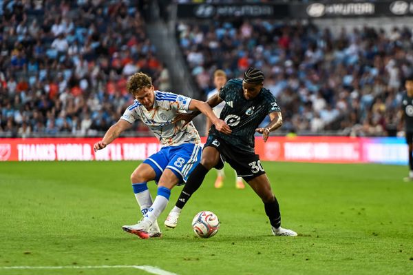 MNUFC midfielder Owen Gene battles San Diego's Onni Valakari for the ball.