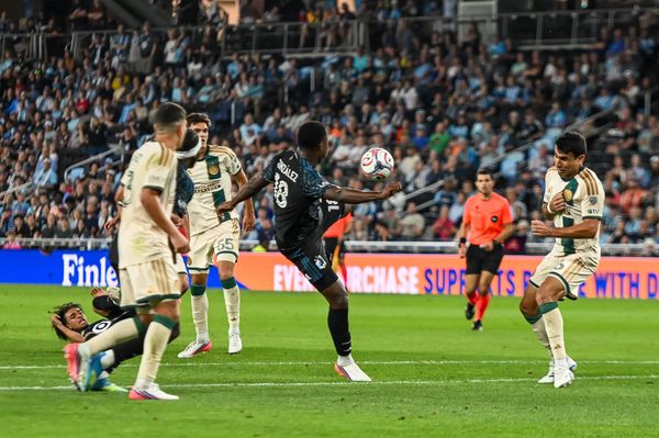 MNUFC striker Mauricio González fires over the net.
