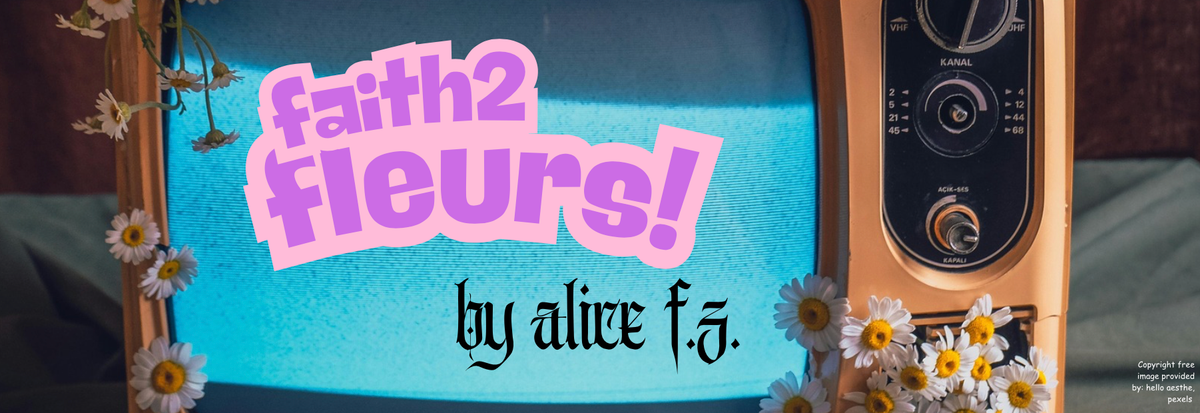 A vintage TV with flowers around the CRT screen with the words “faith2fleurs! by alice f.z.” printed on the screen. 