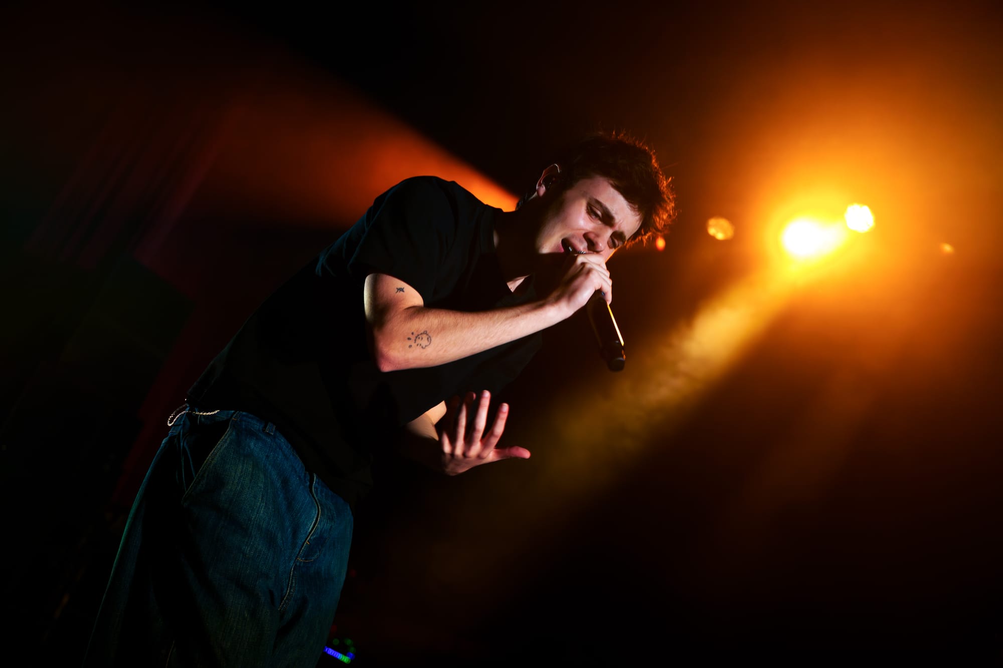 Niko B at The O2 Ritz in Manchester performing on stage holding the microphone in front of his mouth