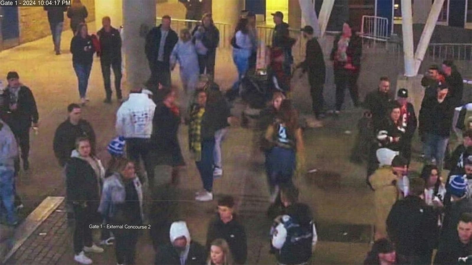 CCTV still of a crowd outside MCG gate 1 at night