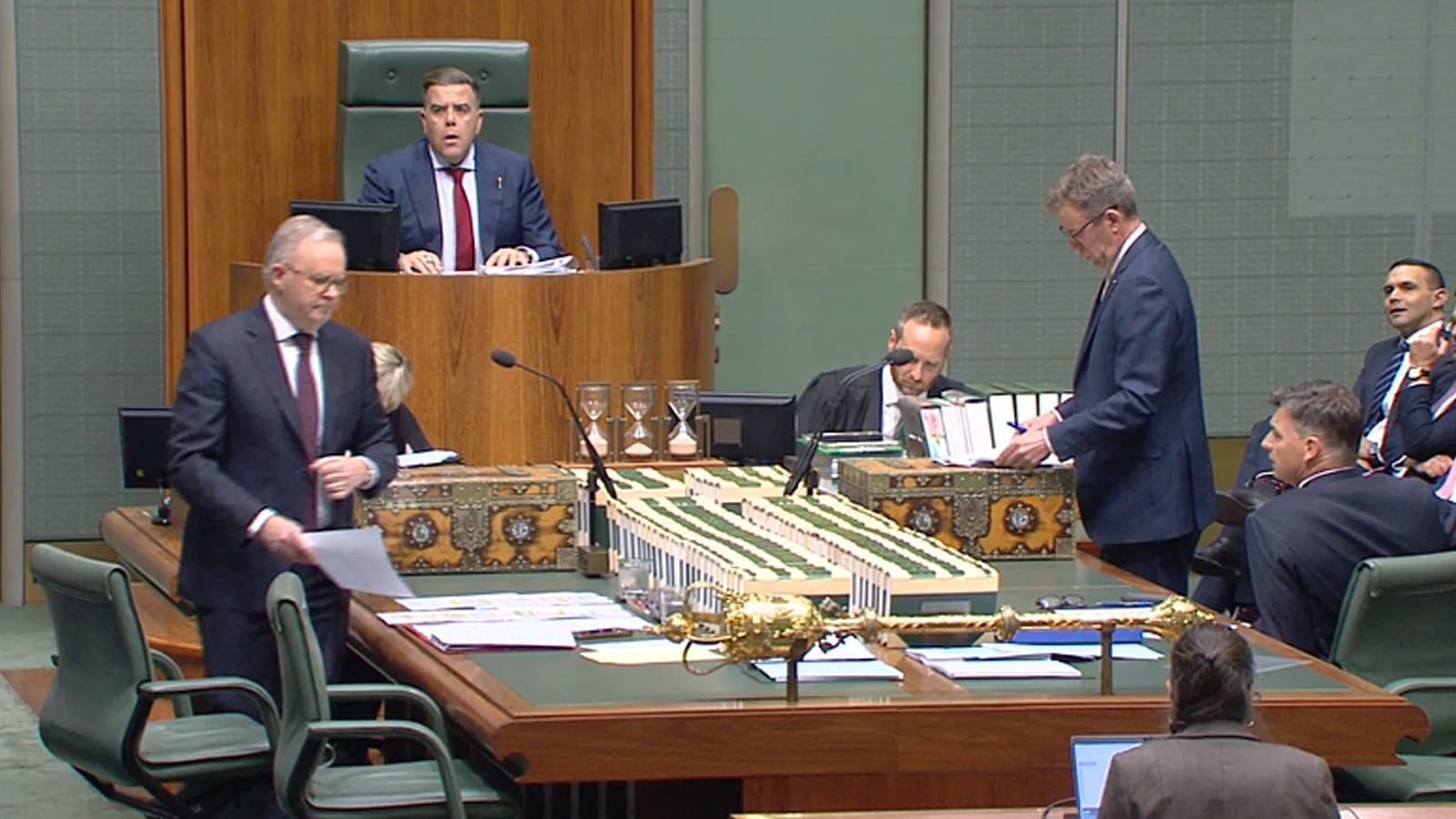 Anthony Albanese and Dan Tehan standing as the Speaker looks on