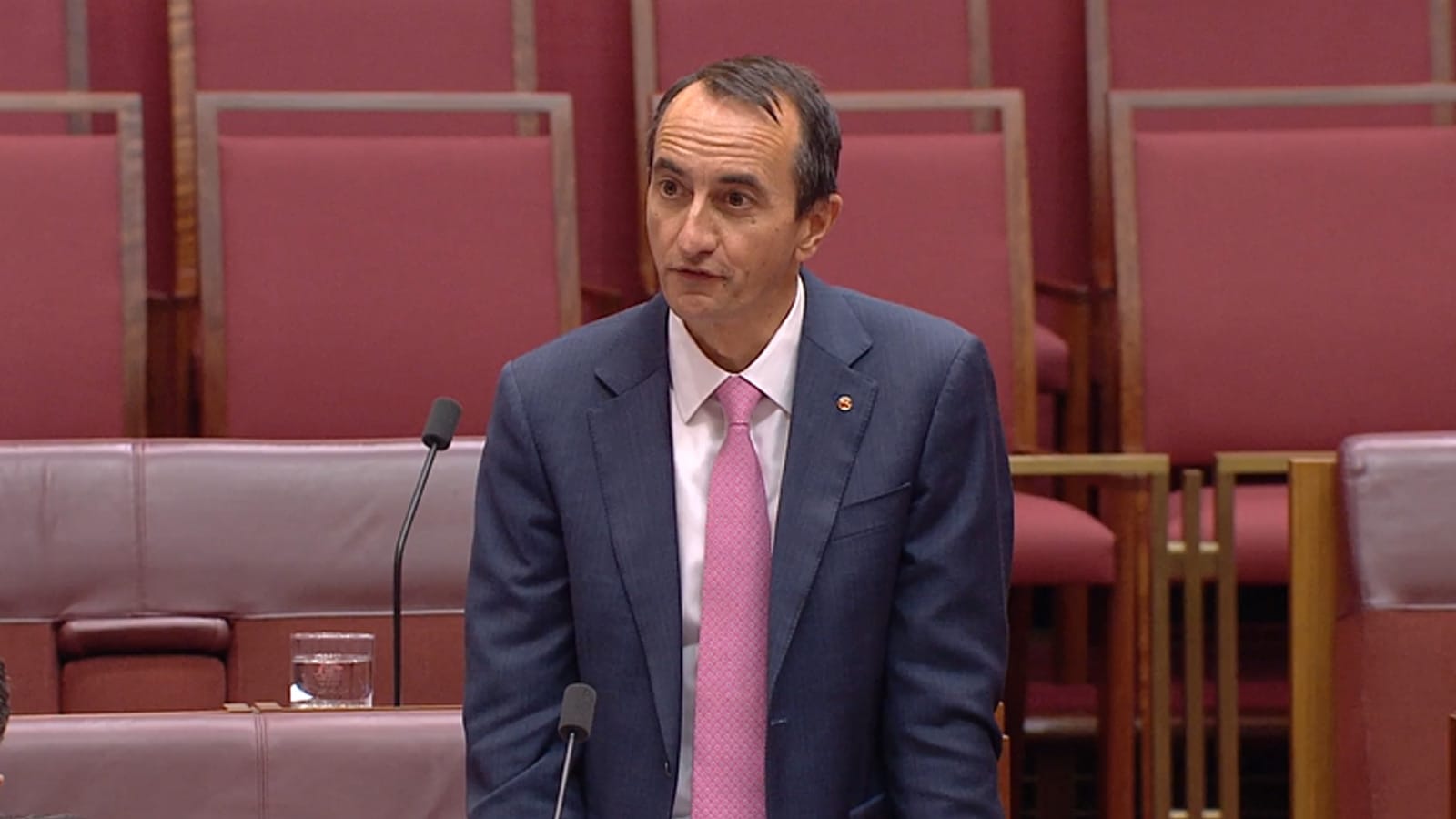 Dave Sharma standing to ask a question in the Senate chamber