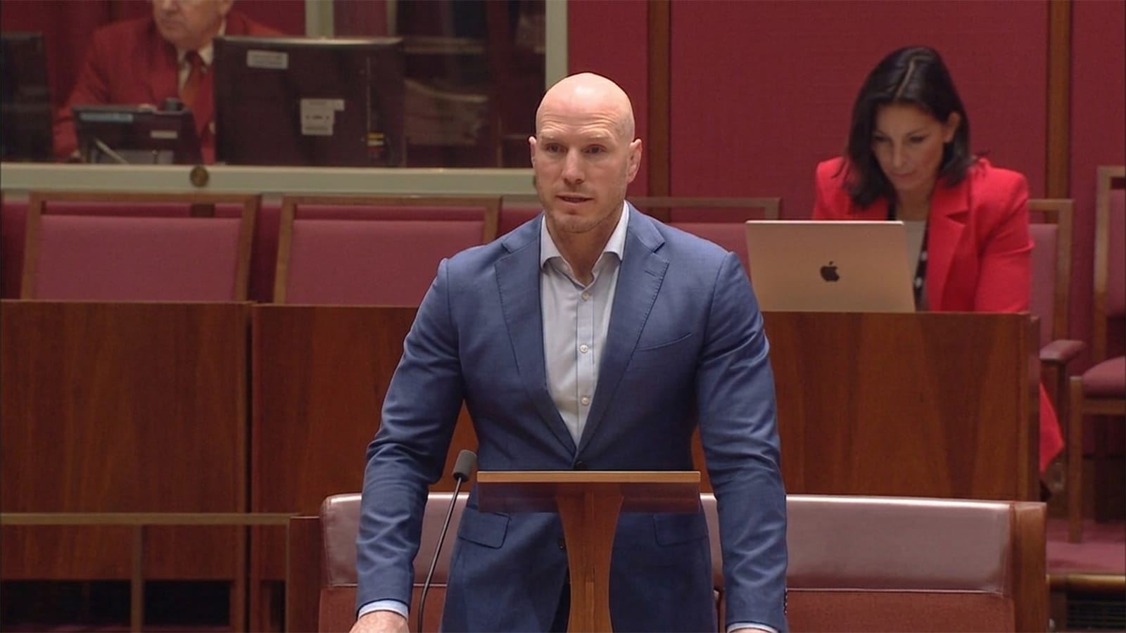 David Pocock standing at a lectern in the Senate chamber