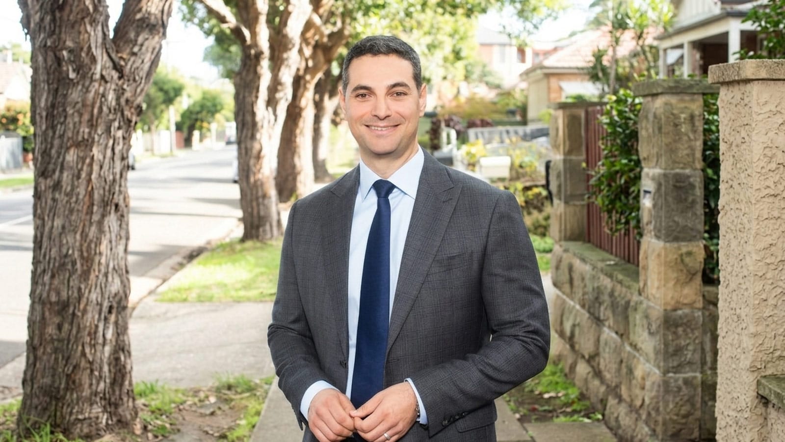 Liverpool Mayor Ned Mannoun standing on a suburban street