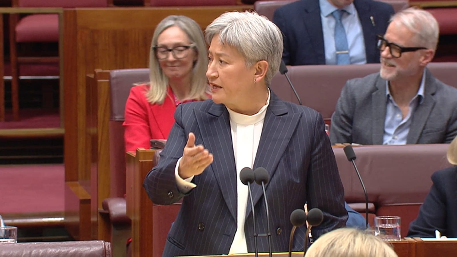 Penny Wong gesturing as she answers a question in the Senate