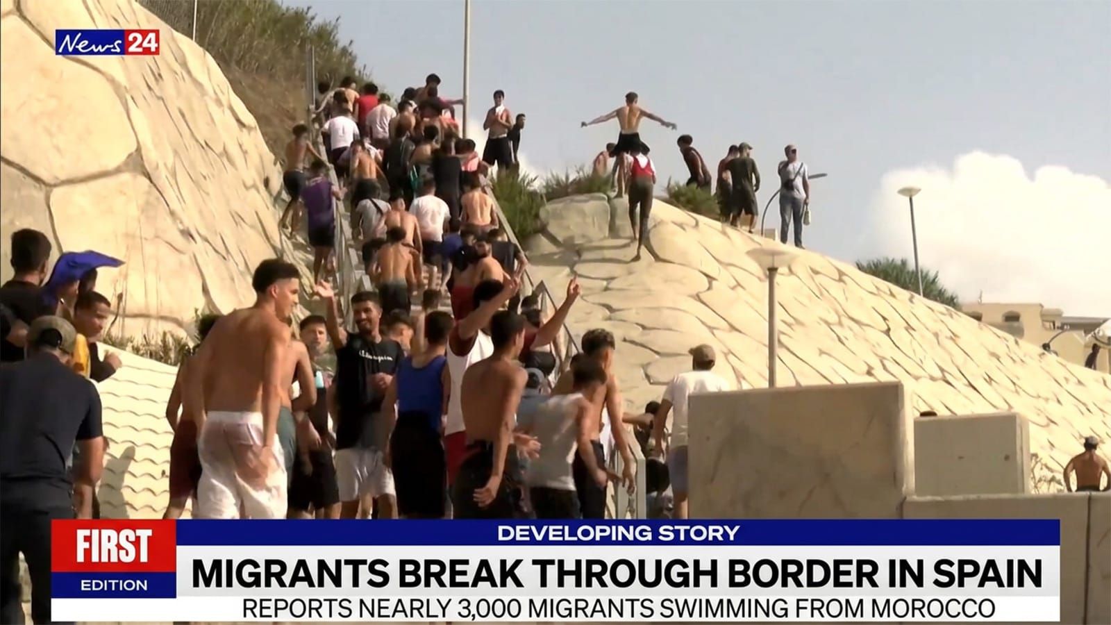 Migrants break through Spain's border in their thousands, weeks after a million were legalised