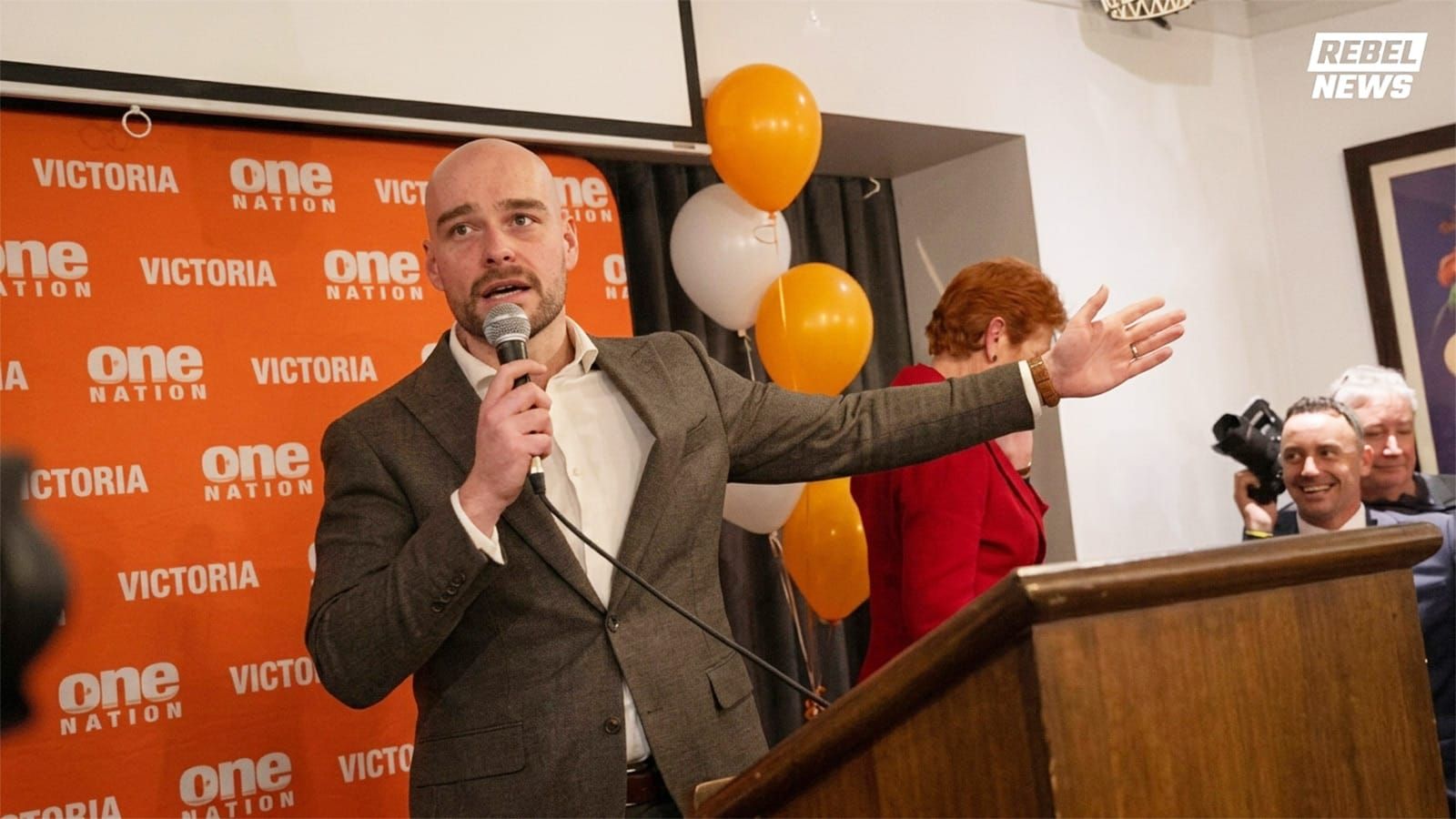 Mark Nicholson speaks at a One Nation Victoria event beside Pauline Hanson.