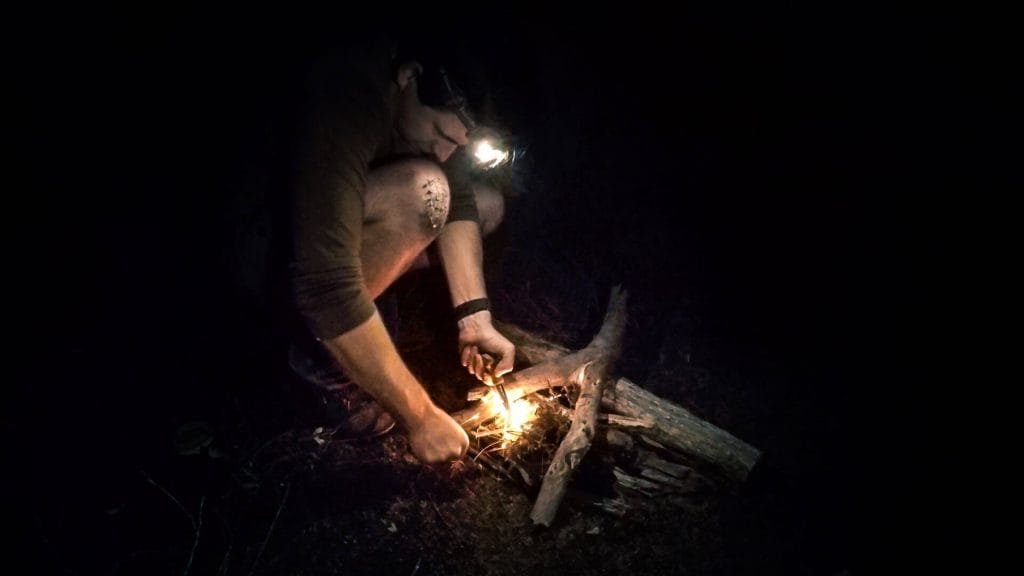 Fire making by torchlight with natural materials