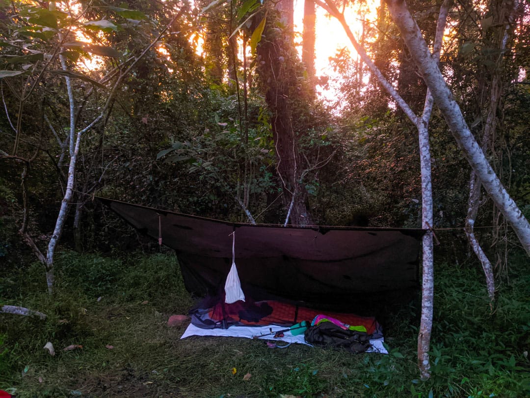 Tarp camping with bug shelter in Australian bush