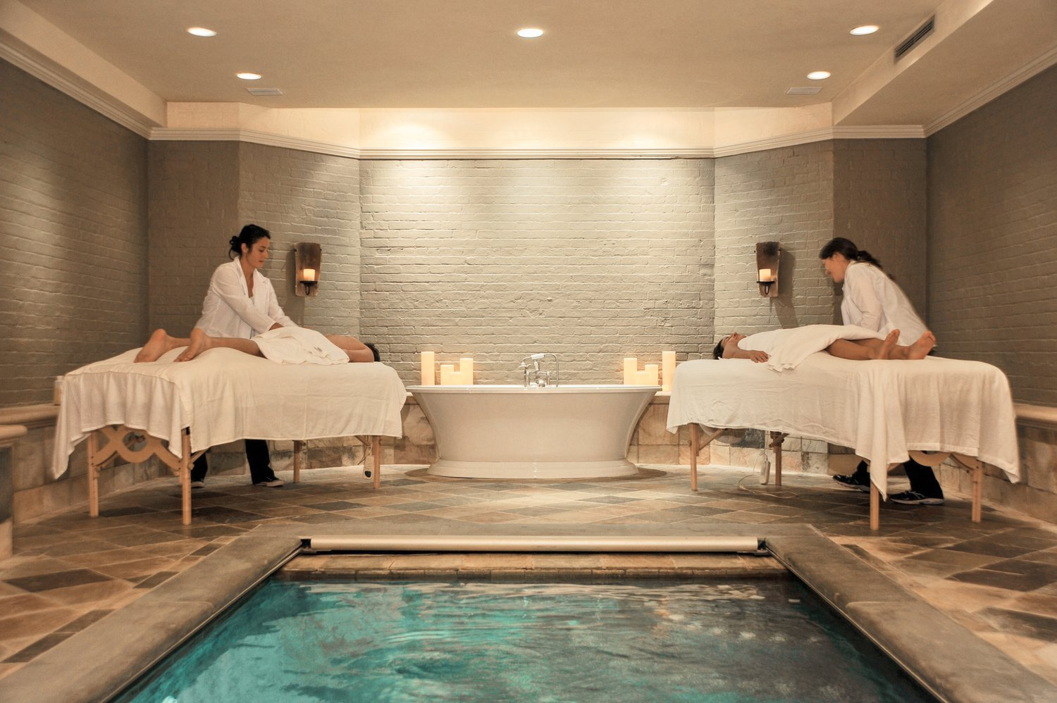 Enjoy the tranquility of the intimate spa room as skilled therapists provide exquisite treatments in the ambiance with glowing candles and a pristine pool. 