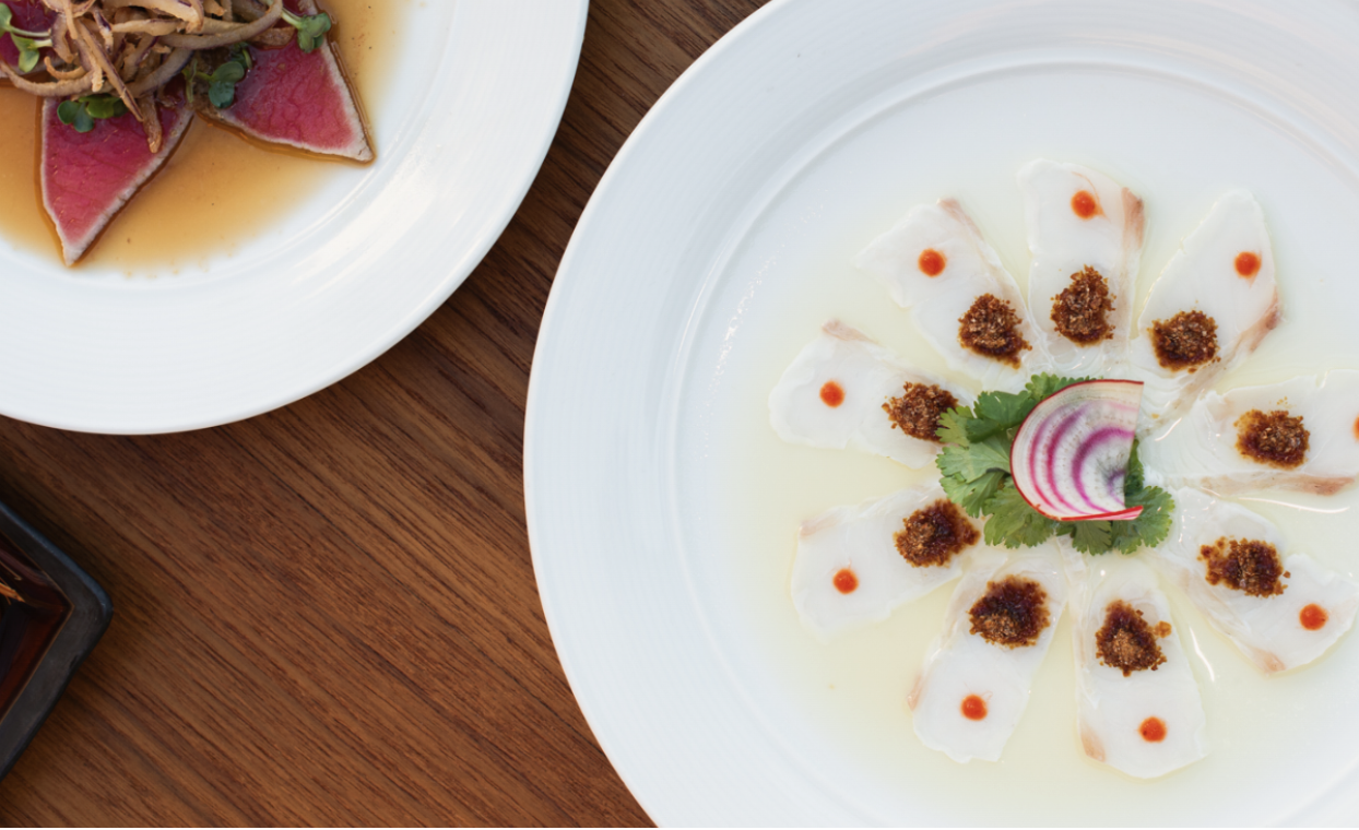 A top-down view of two delectable seafood plates.&nbsp;&nbsp;