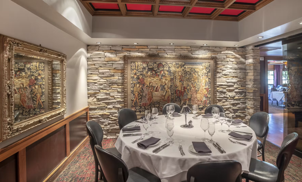 Enjoy the tranquil atmosphere at Mastro’s Ocean Club, where an ornate mirror and an intricate painting adorn the walls.